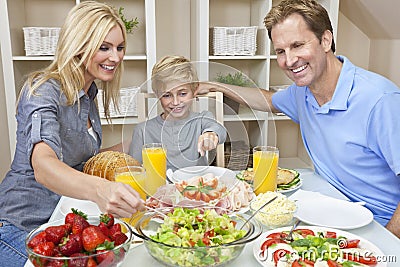 family-eating-healthy-food-salad-dining-table-23740634.jpg