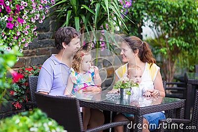 Family eating lunch in outdoor cafe