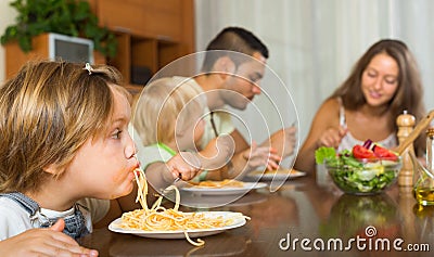 Family eating spaghetti