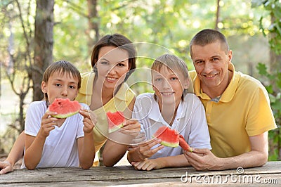 Family eating a watermelon