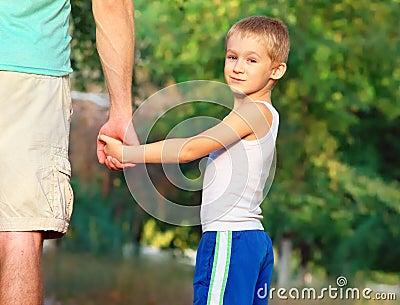 Family Father Man and Son Boy Child holding hand in hand Outdoor Happiness emotion