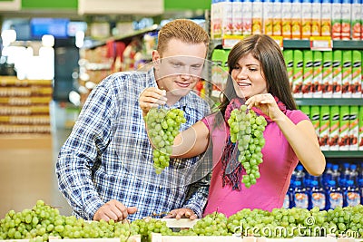 Family at fruit food shopping in supermarket