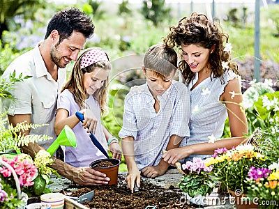 Family have fun in the work of gardening