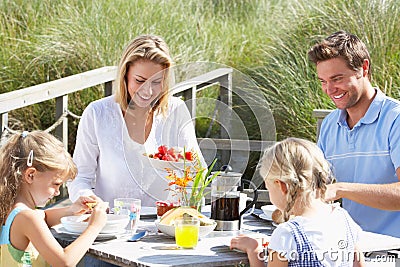 Family having breakfast outdoors on vacation