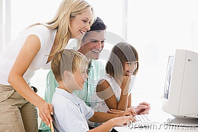 Family in home office using computer