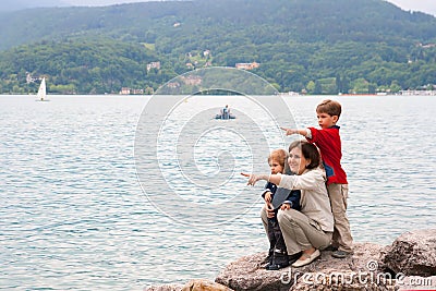 Family on lake bank