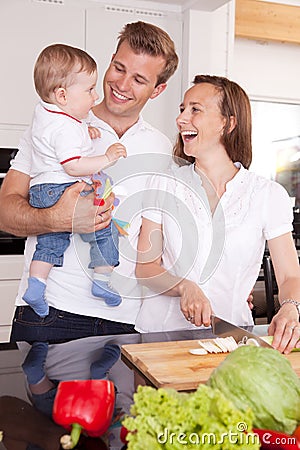 Family Laughing in Kitchen