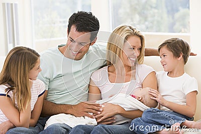 Family in living room with baby