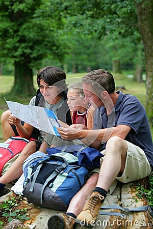 Family looking at hiking map