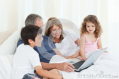 Family looking at their laptop