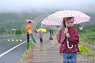 Family under the rain