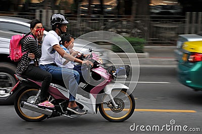 Family on a Motorcycle in Central Bangkok