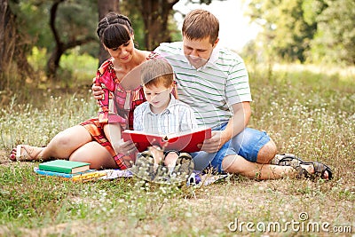 Family reading together. Summer holiday