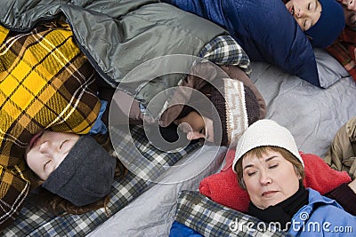 Family Sleeping In Tent