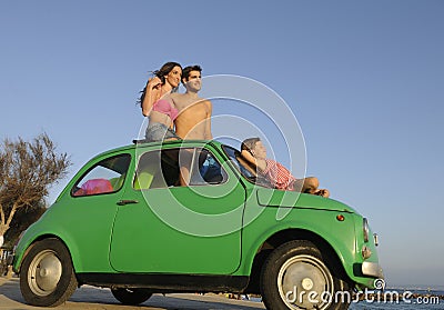 Family with small car on vacation