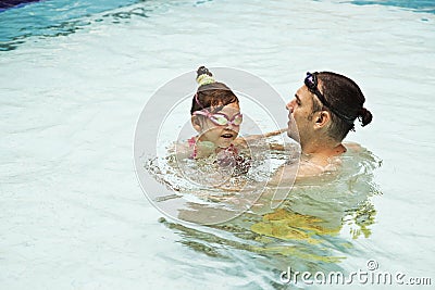 Family in swimming pool