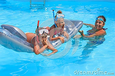 Family in the swimming pool