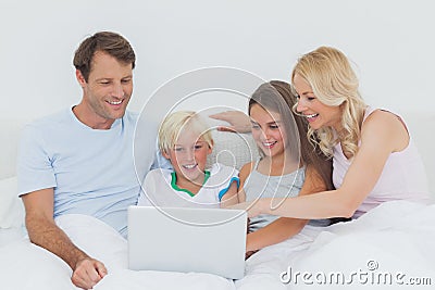 Family using a laptop