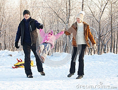 Family walking in a winter park