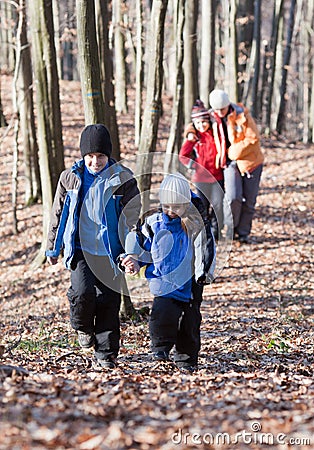 Family walking in the woods