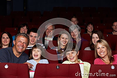 Family Watching Film In Cinema