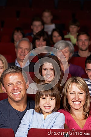 Family Watching Film In Cinema