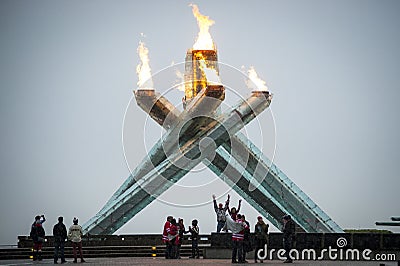 Fans cheer at Olympic flame in Vancouver