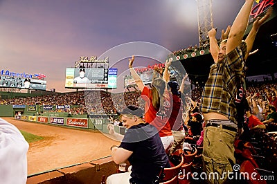 Fans do the wave at Fenway Park