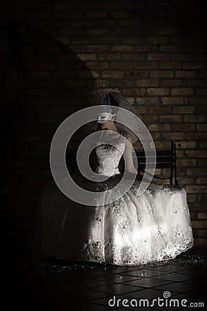 Fantasy woman wearing mask and white wedding dress