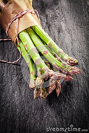Farm fresh asparagus tips in a brown wrapper