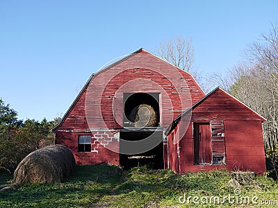 Farm: old red barn with hay bales