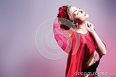 Fashion asian woman wearing traditional japanese red kimono. Gei