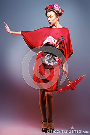 Fashion asian woman wearing traditional japanese red kimono