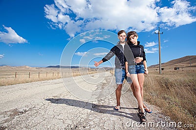 Fashion couple try to stop the car on old road