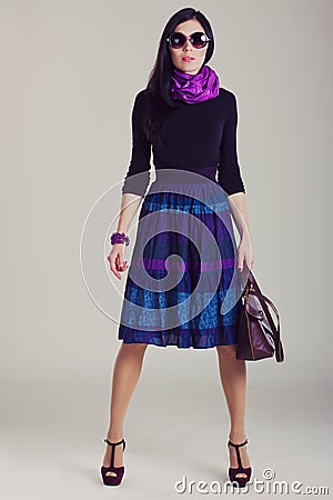 Fashion magazine shoot. Girl in fashionable clothes