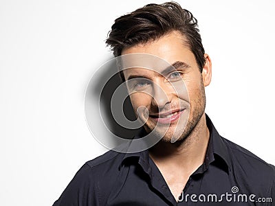 Fashion portrait of young man in black shirt