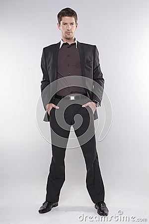 Fashion shot of an elegant young man wearing suit