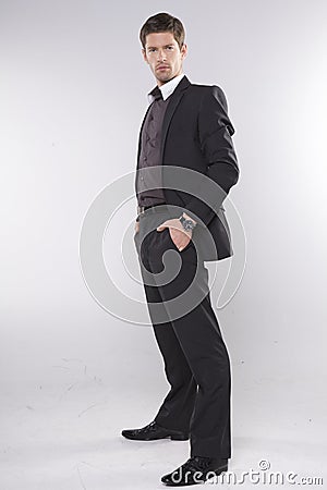 Fashion shot of an elegant young man wearing suit