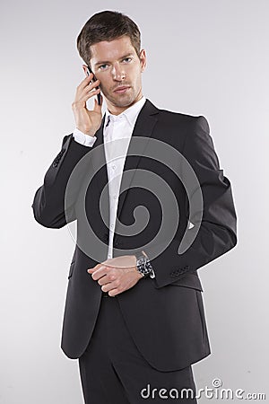 Fashion shot of an elegant young man wearing suit