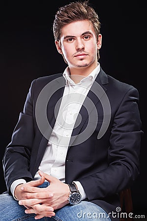 Fashion young businessman black suit