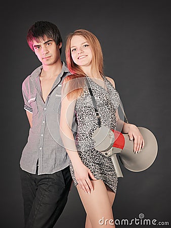 Fashion young couple, studio shot on black