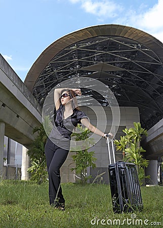 Fashionable Asian Chinese Lady with her luggage