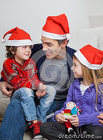 Father And Children In Santa Hats