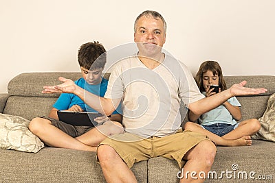 Father and children sitting on the sofa