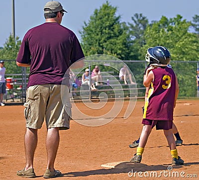 Father Coaching Daughter s Softball