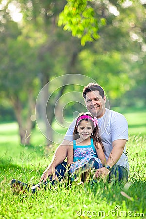 Father and daughter enjoying afternoon in the park