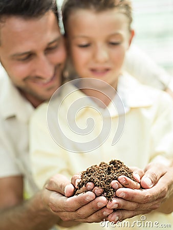 Father educate son to care a soil