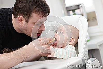 Father feeding his baby