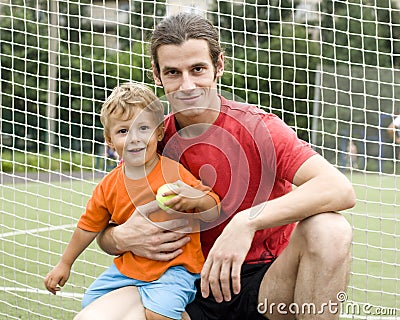 Father with his son after a football game, photo in motion