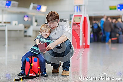Father and little son at the airport
